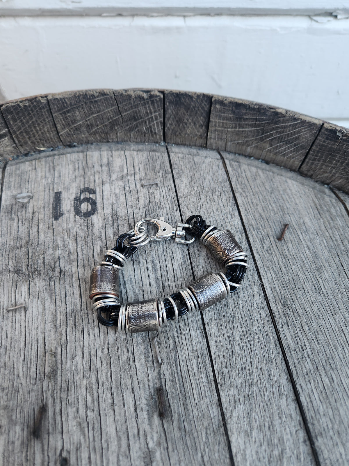 Custom United States Half Dollar Coin and Black Ring Bracelet with Unique Design and Secure Closure